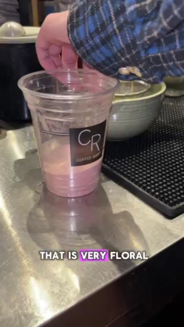 Pink cherry blossom milk base in a CR Coffee Shop cup before the matcha layer