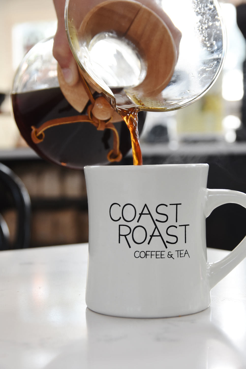 Chemex pour into a Coast Roast mug