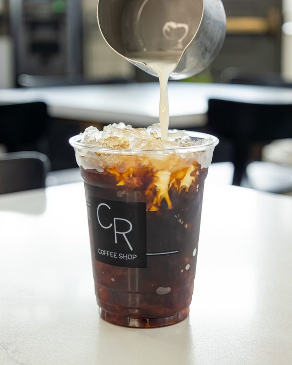 Milk pour into CR Coffee iced coffee