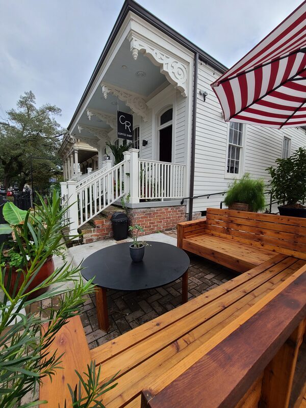 Magazine Street courtyard with seating and string lights