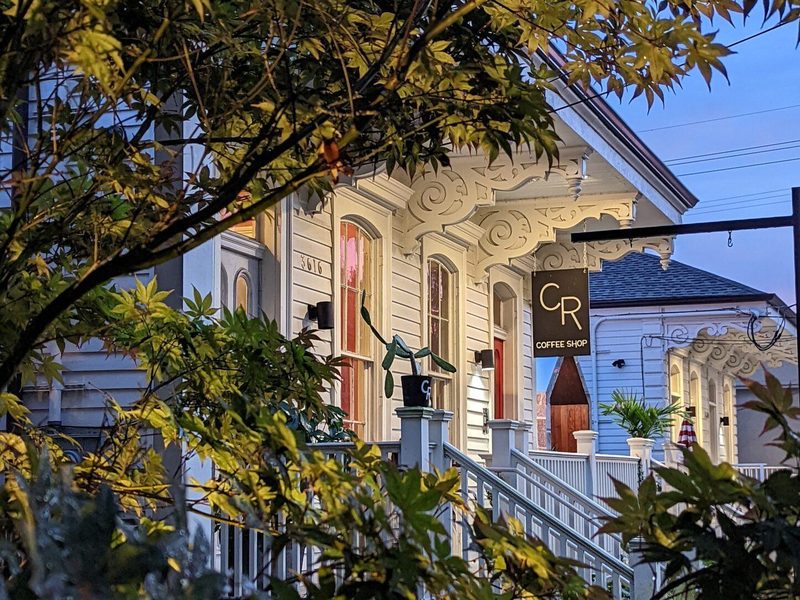 CR Coffee Shop Magazine Street storefront at dusk