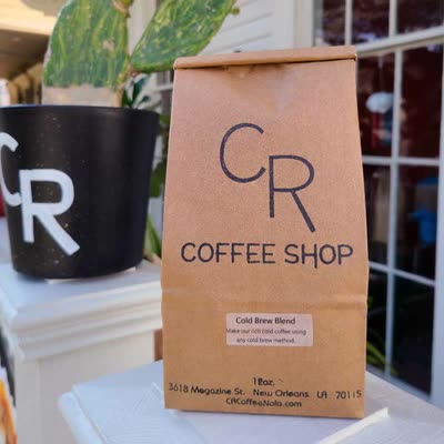 A bag of Cold Brew Blend on the Magazine Street porch