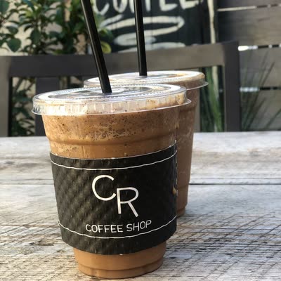 Two Chocolate-Covered Espresso Bean Frozen drinks dusted with ground espresso