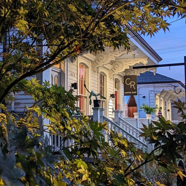 CR Coffee Magazine Street storefront at dusk