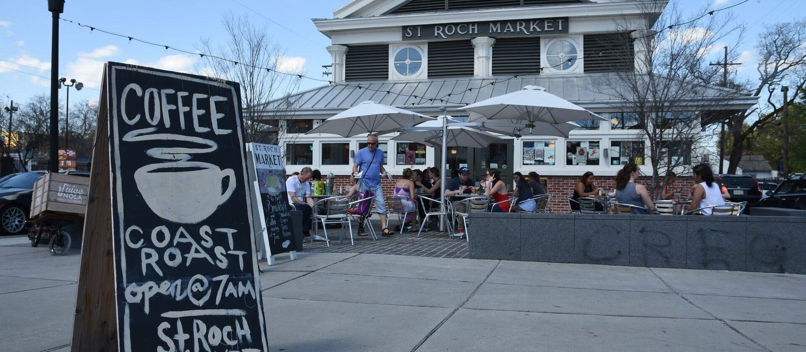 St. Roch Market storefront with CR Coffee sidewalk sign