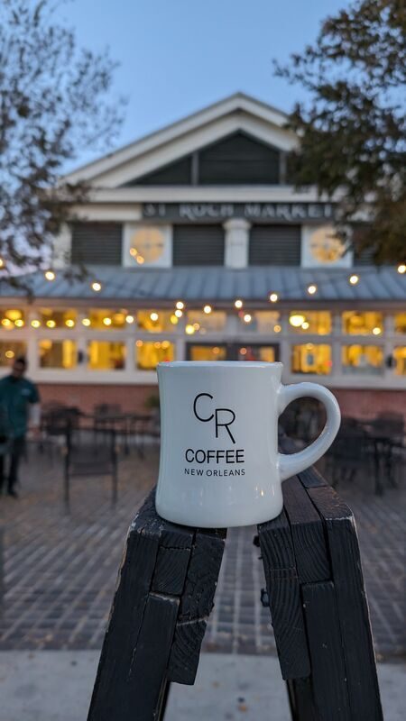 CR Coffee mug at dusk at the St. Roch Market stall