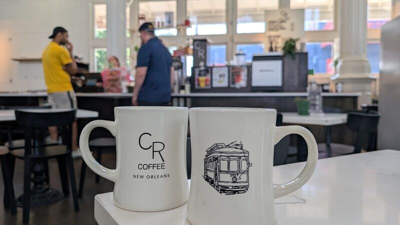 CR Coffee mugs displayed inside St. Roch Market