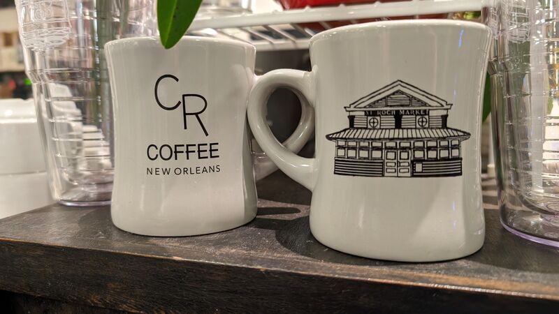 Two CR Coffee mugs stacked at the St. Roch Market stall